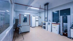  Laboratory equipped with advanced machinery and testing equipment for quality control in flooring production.