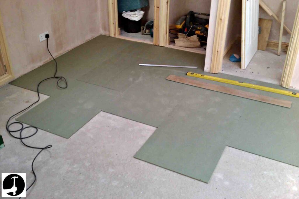 Green underlayment panels installed before SPC flooring